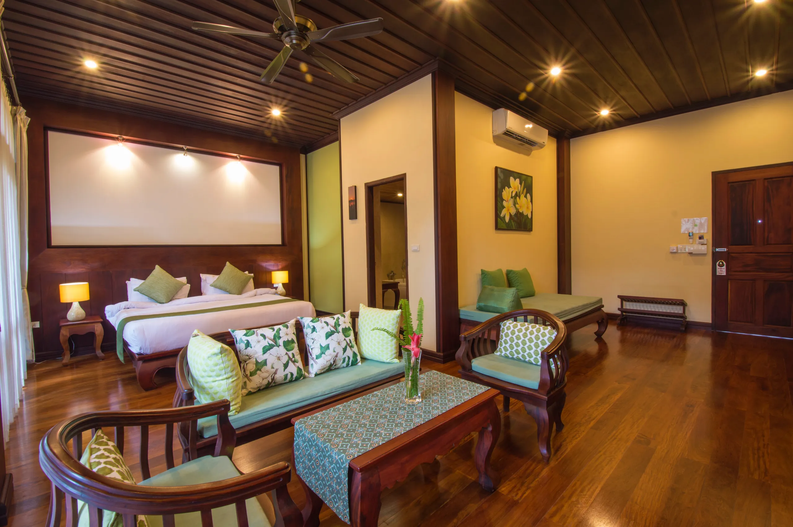 A Suite sitting room furnished with handmade Lao timber furniture